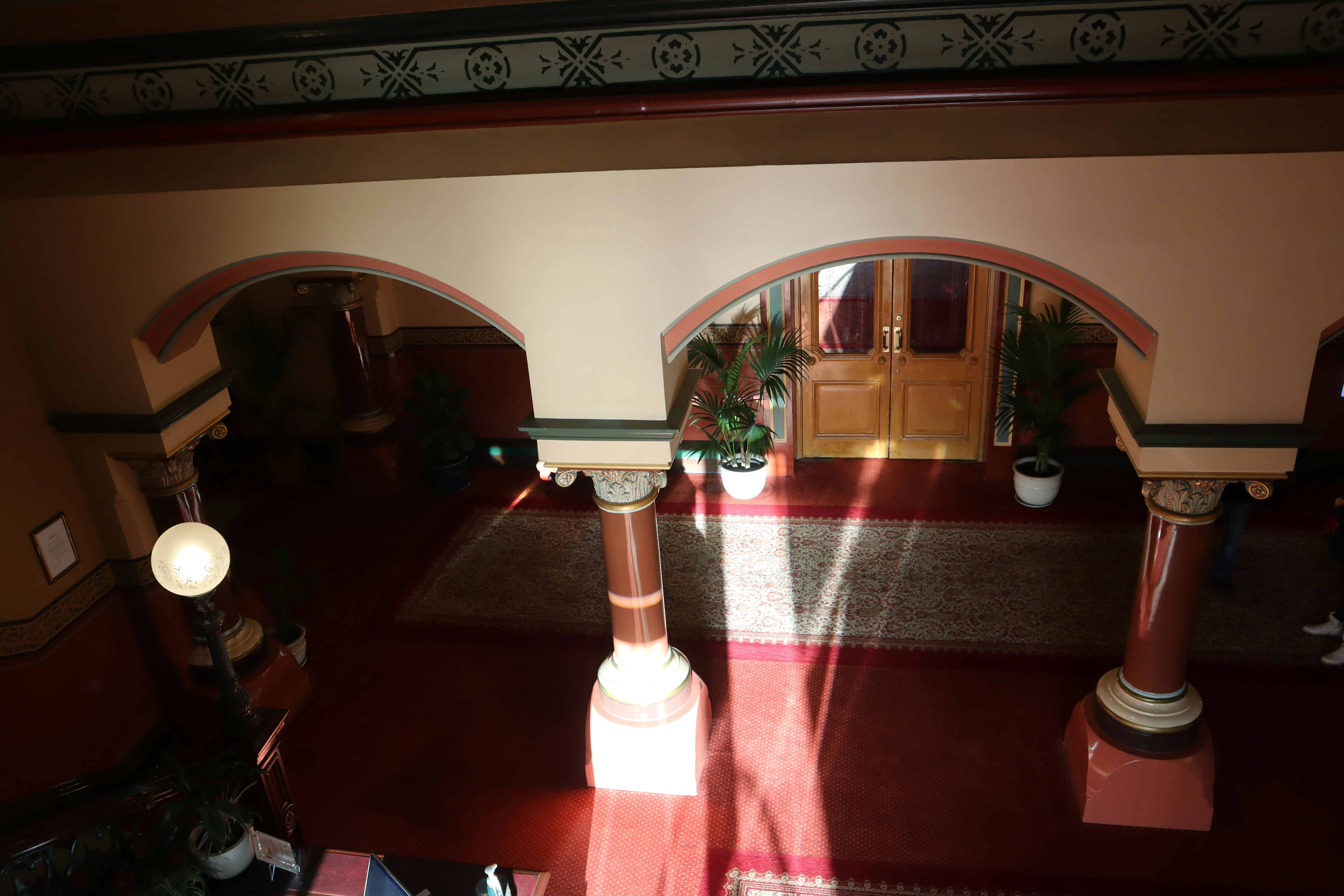 a view of a hallway from above looking down