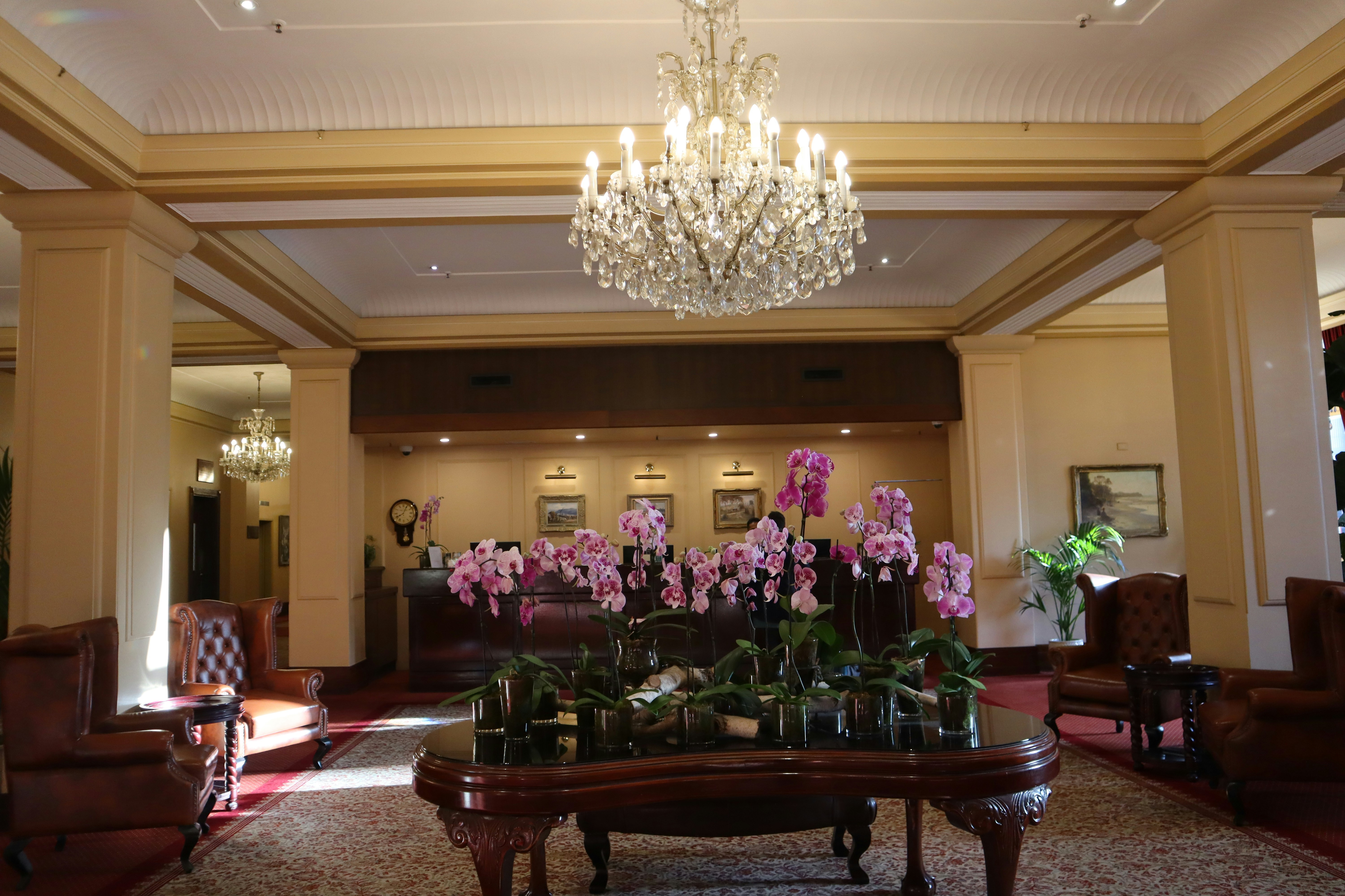 A living room filled with furniture and a chandelier