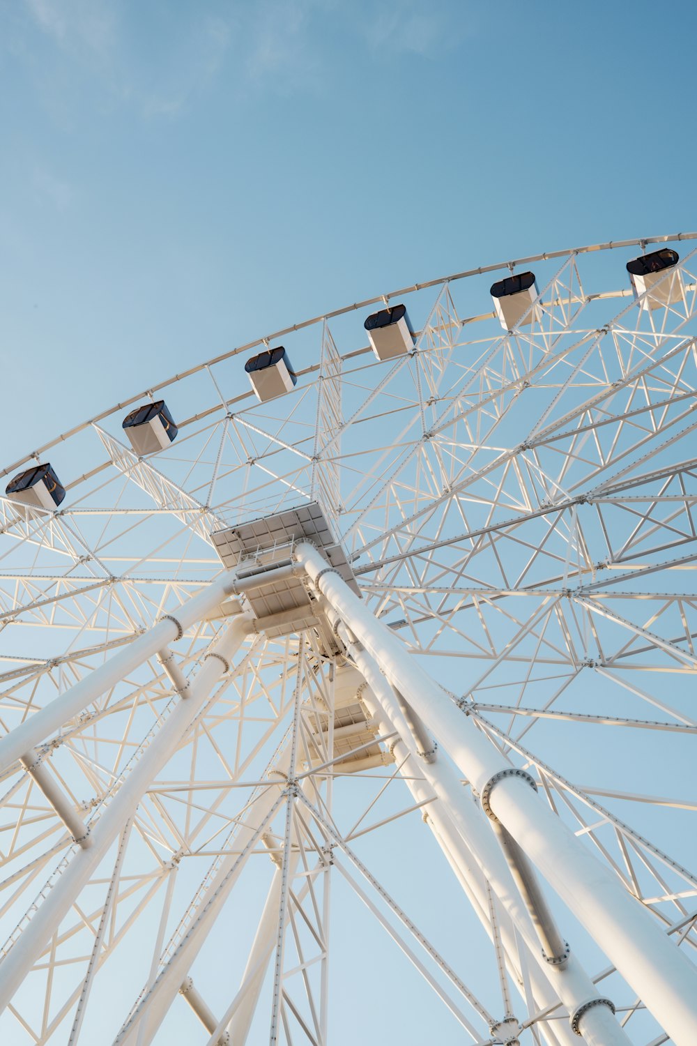 a large white ferris wheel on a clear day