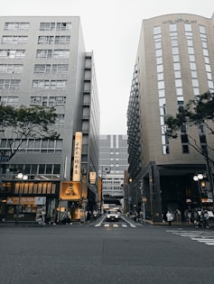 a couple of tall buildings sitting next to each other