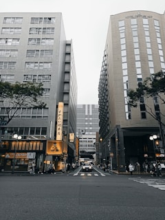 a couple of tall buildings sitting next to each other