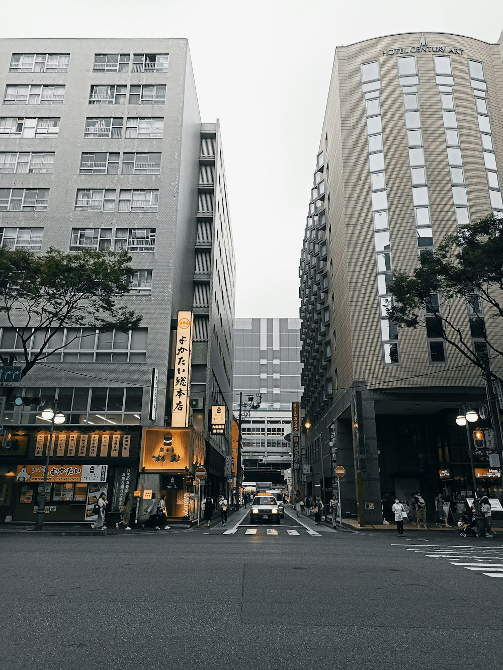 a couple of tall buildings sitting next to each other