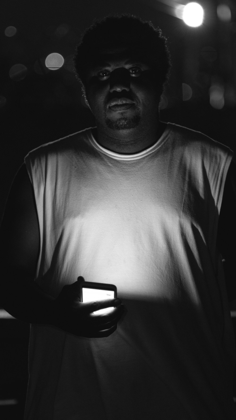 a man holding a lit object in his hands