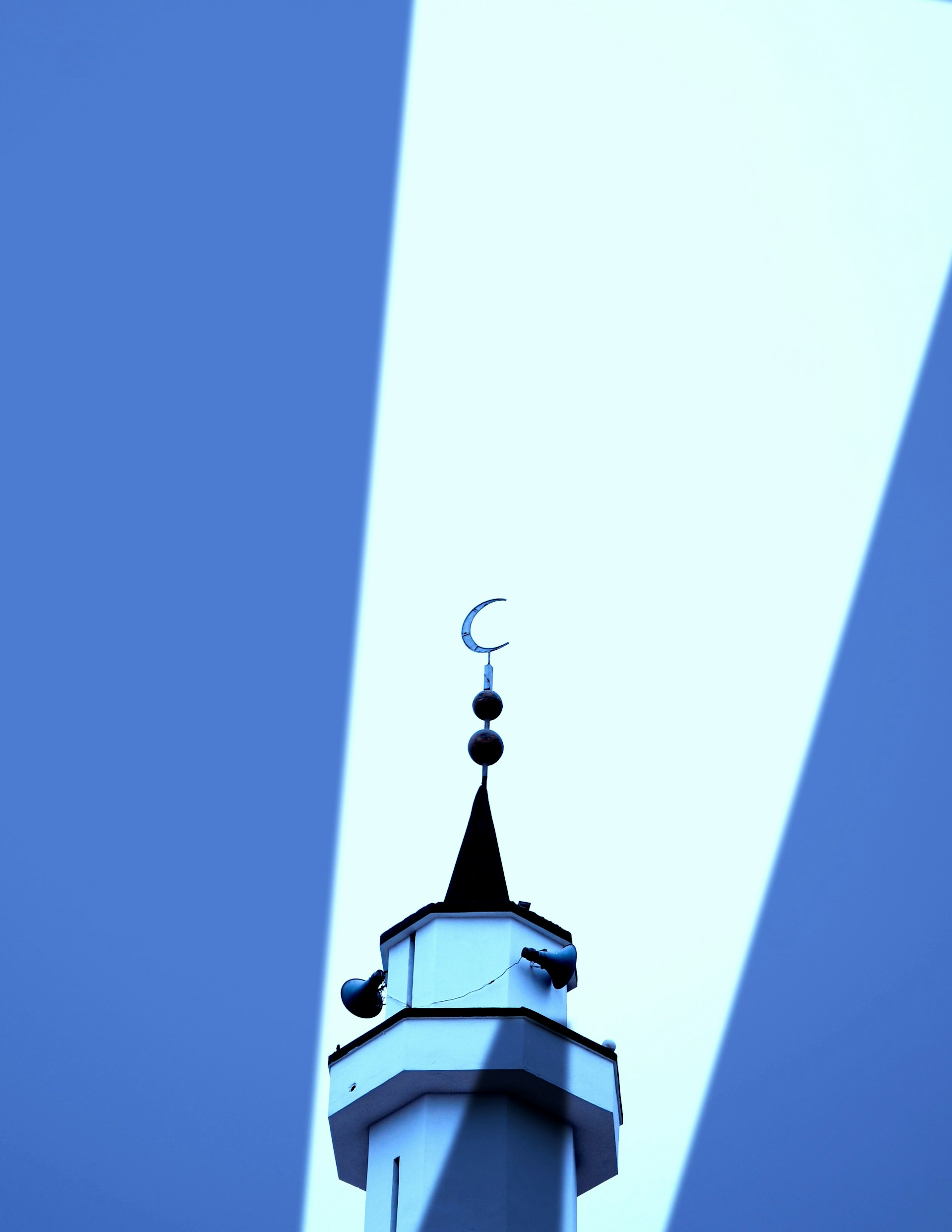 a tall tower with a clock on top of it