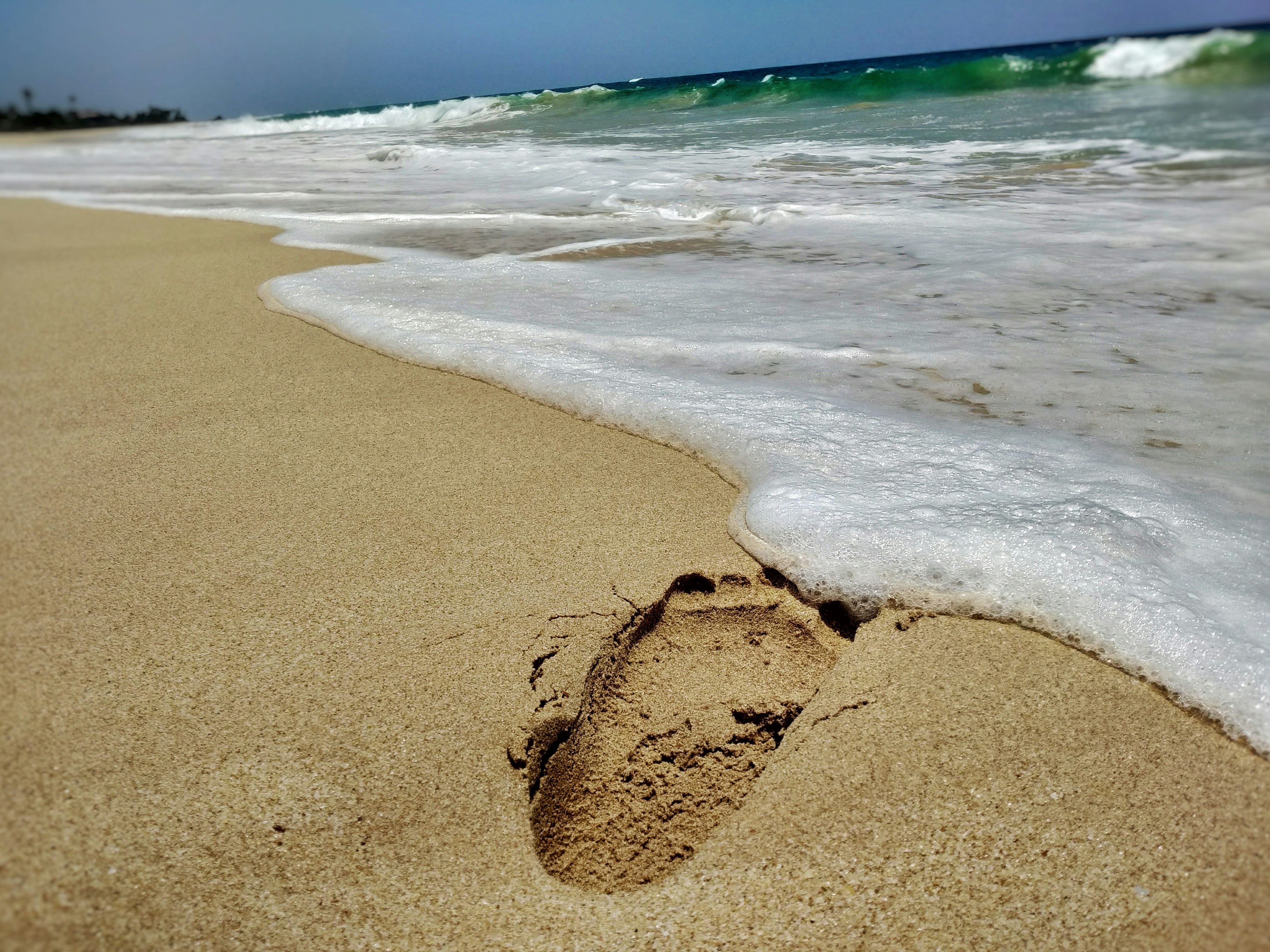 a footprints in the sand on a beach
