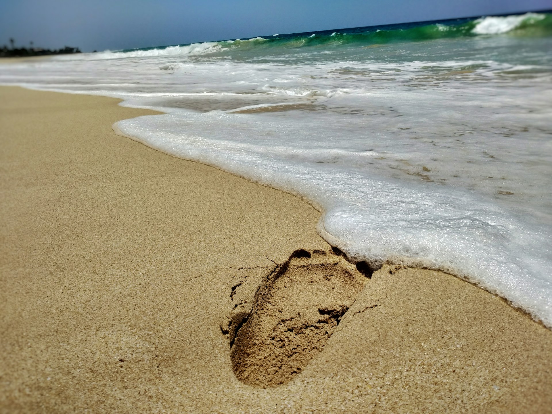 a footprints in the sand on a beach