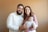 a man and a woman holding a baby