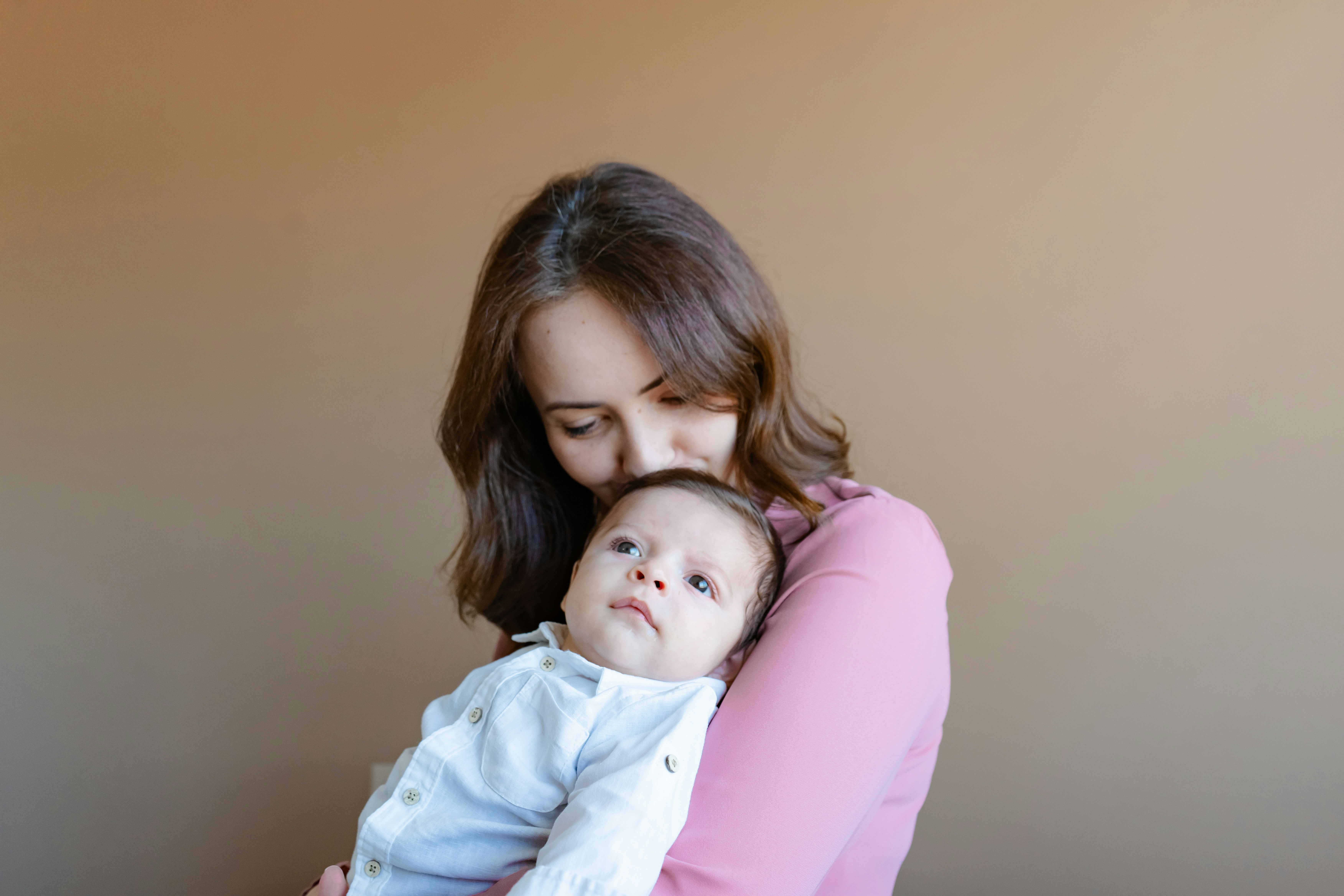 Mother holding newborn baby, representing postpartum support, bonding, and early intervention for postpartum depression