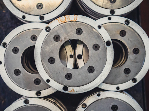 a pile of metal wheels stacked on top of each other