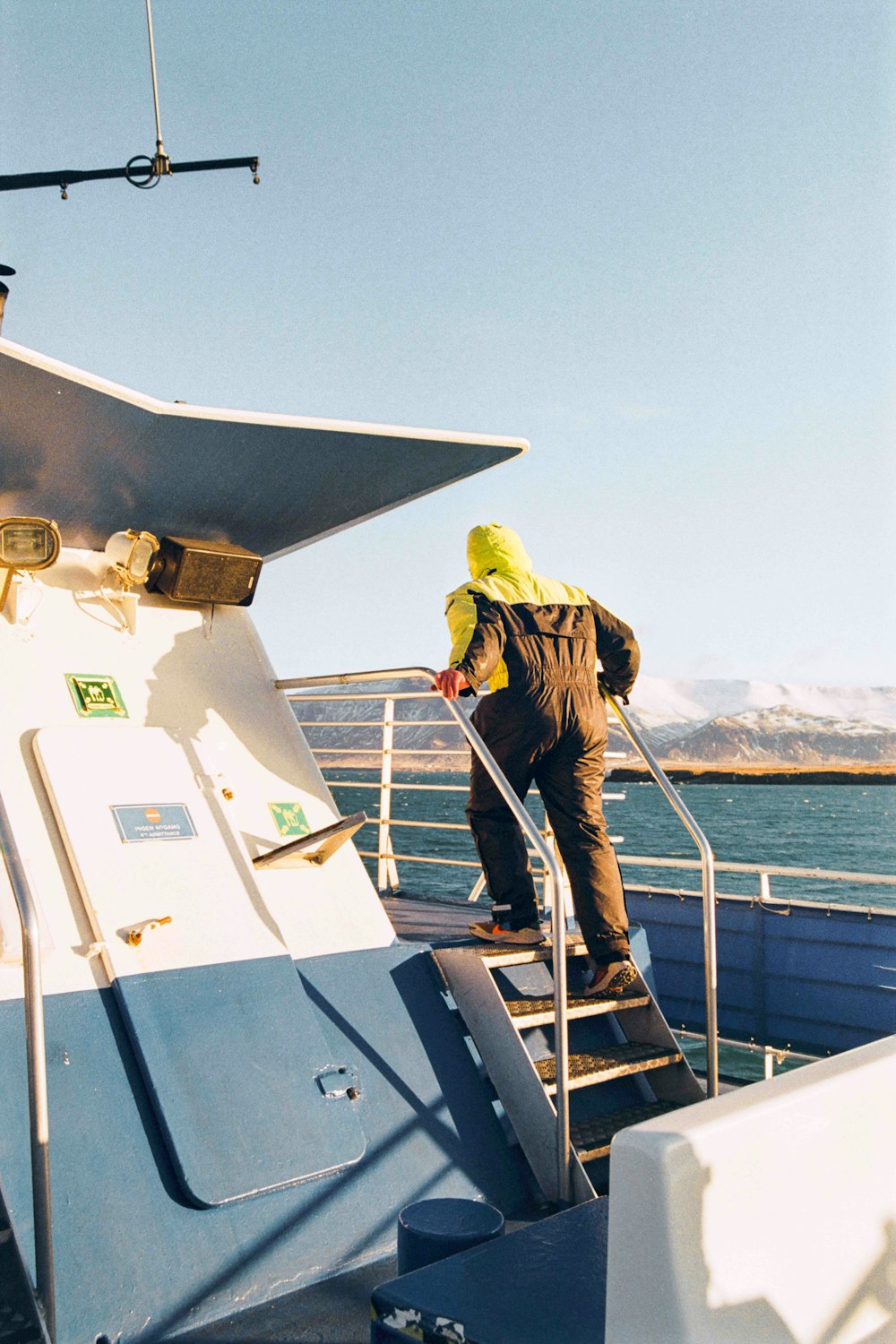 a person on a boat with a yellow hat