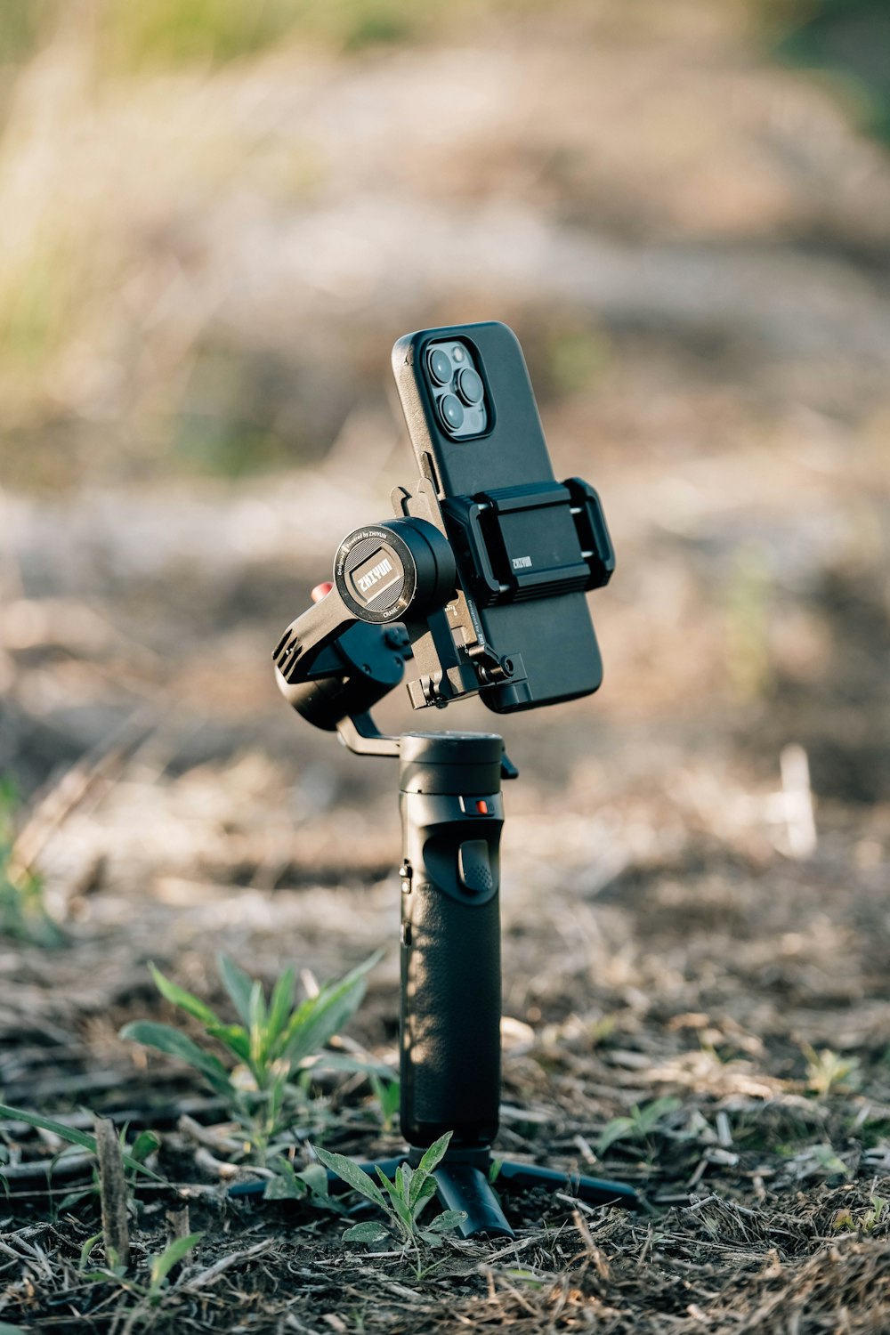 a tripod with a camera attached to it