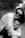 a woman is hugging a young boy in a black and white photo