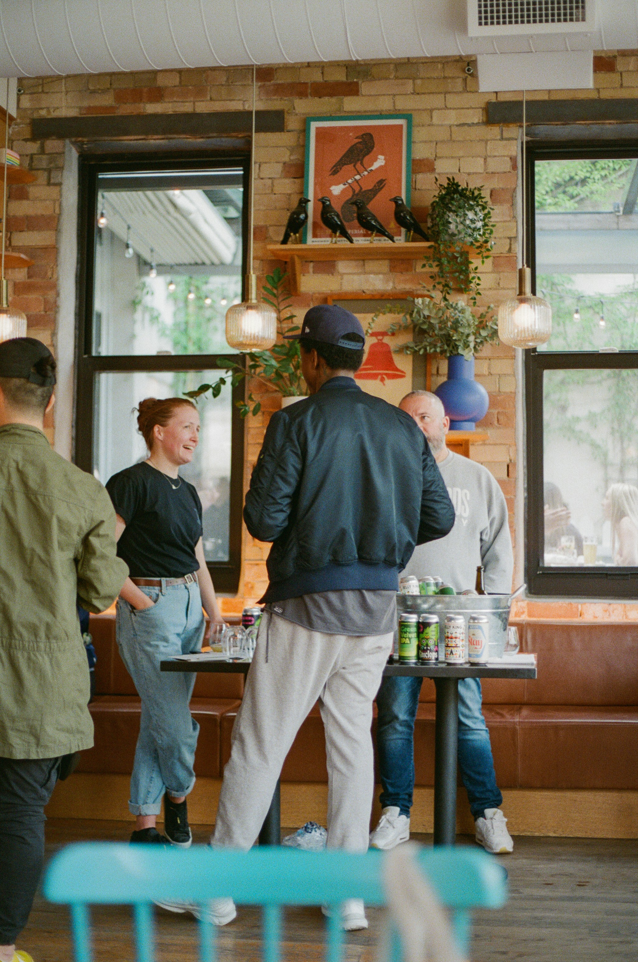a group of people standing around a table
