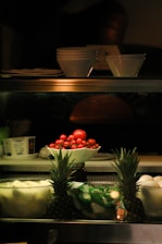 a display case filled with fruits and vegetables