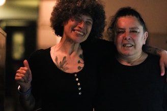 a couple of women standing next to each other