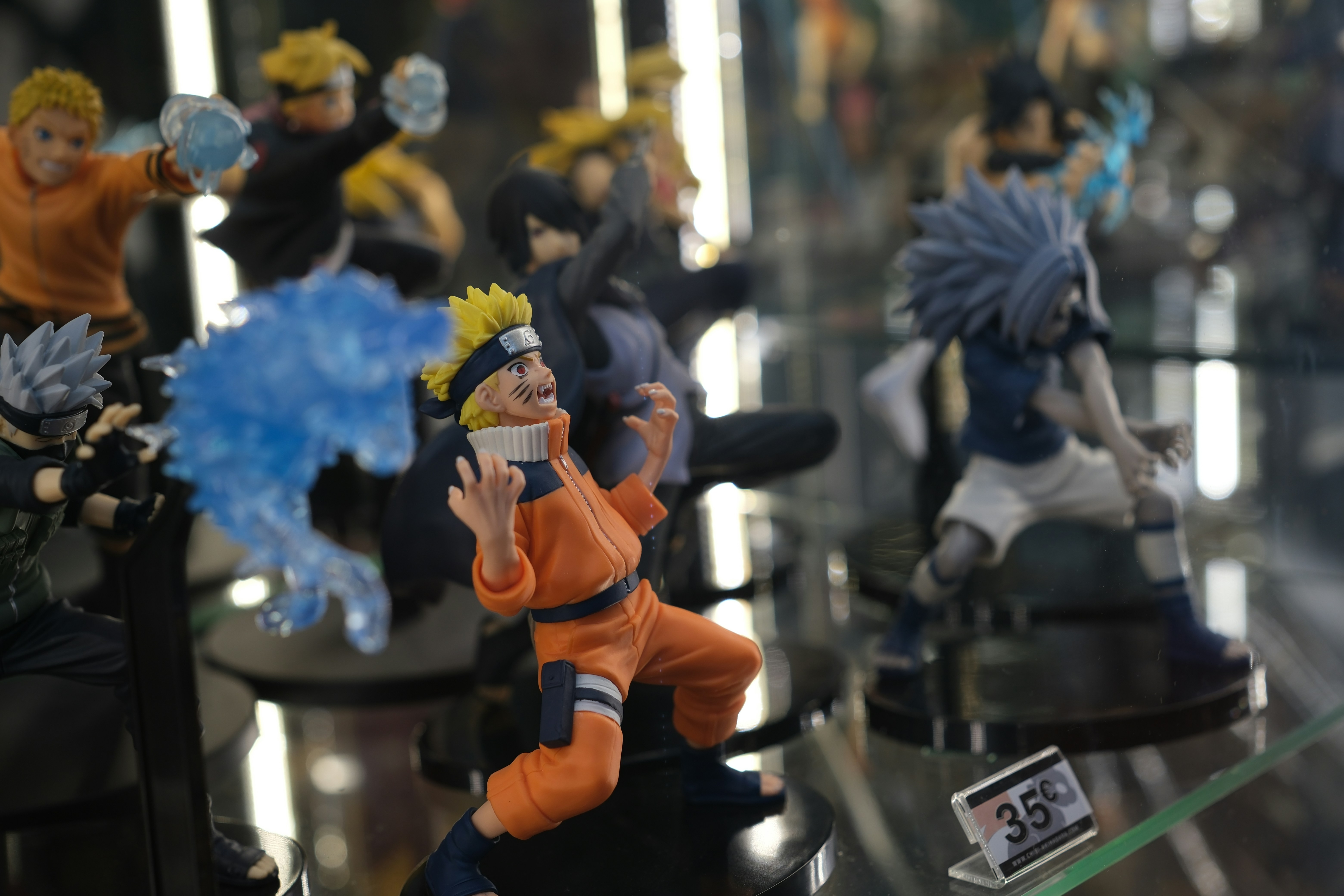 a collection of action figures sitting on top of a table