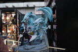 a statue of a woman with a dragon on top of it