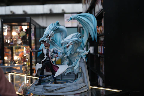 a statue of a woman with a dragon on top of it
