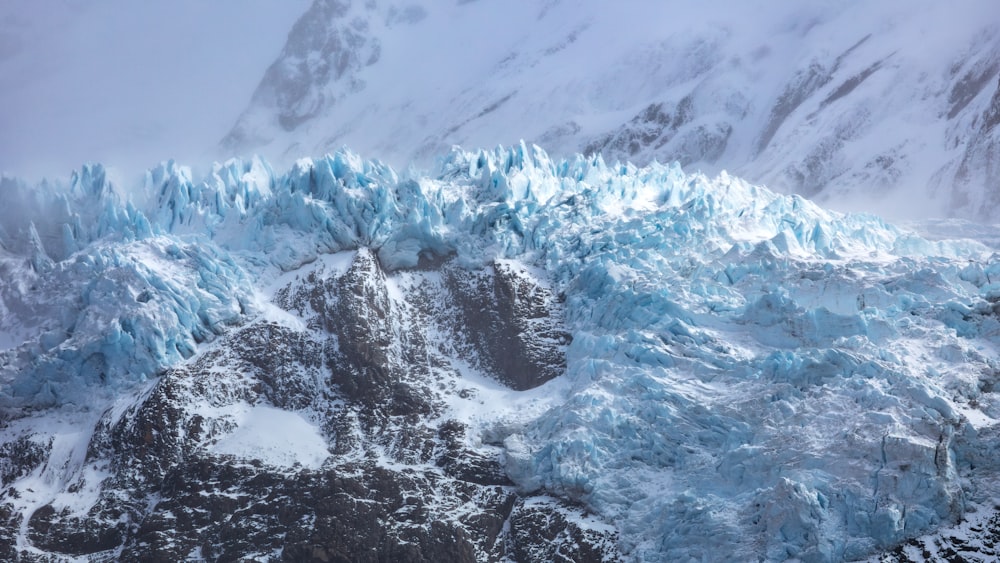 an aerial view of a glacier in the mountains