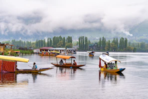 a group of boats floating on top of a lake
