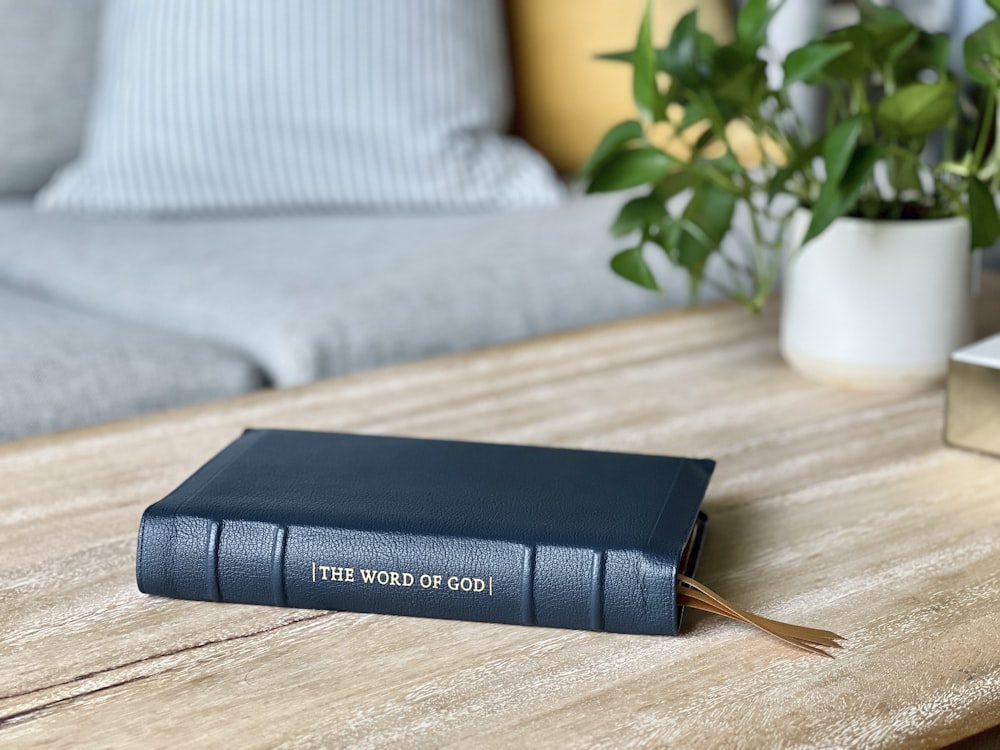 a blue book sitting on top of a wooden table