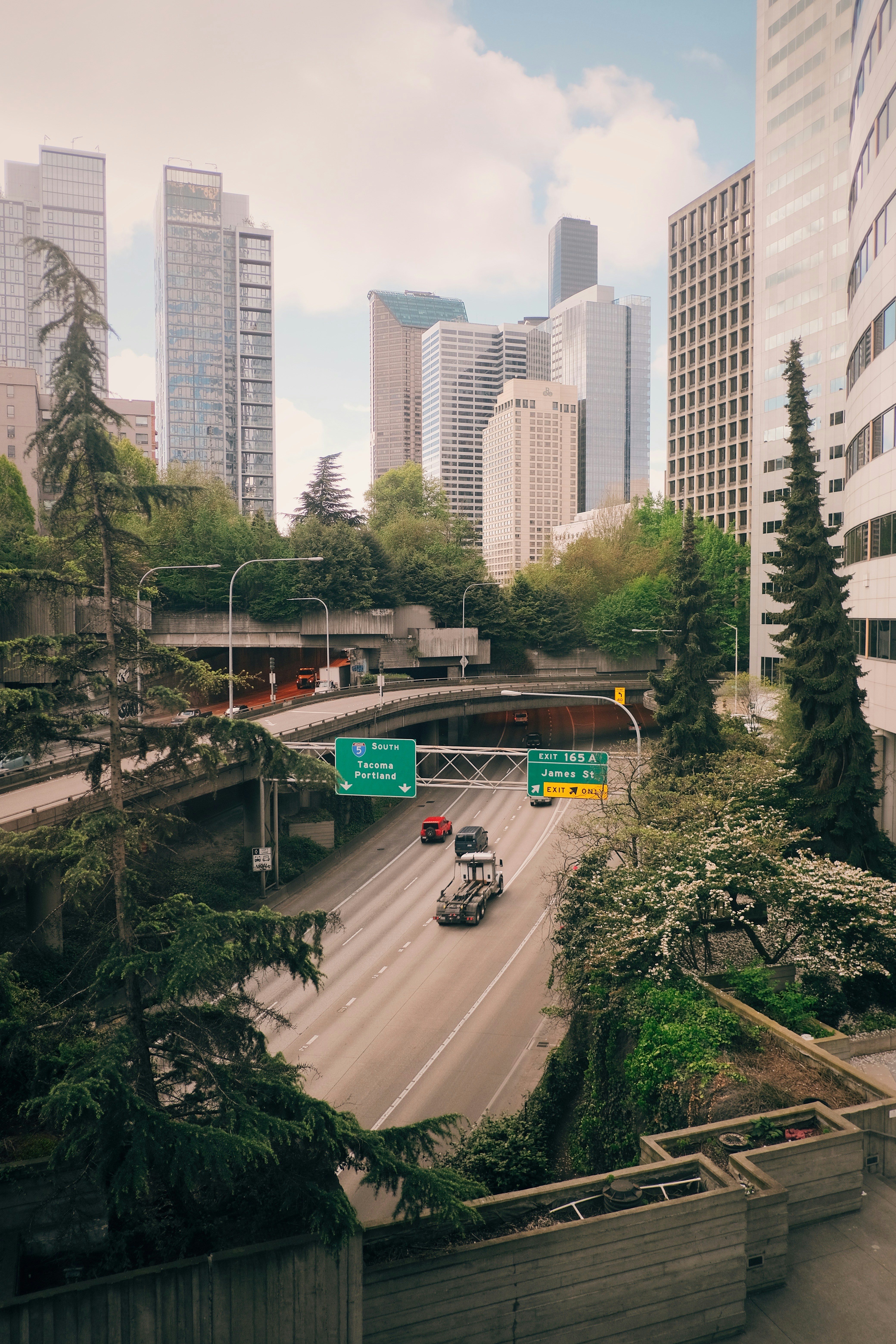 a city street with a bridge over it