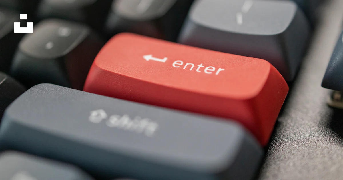 A computer keyboard with a red enter button photo – Free Enter Image on ...