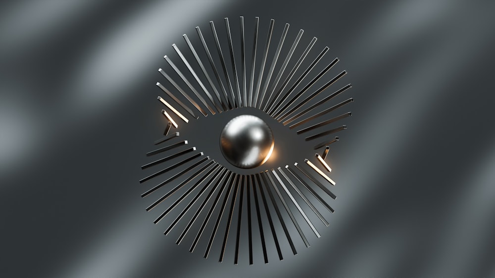 a shiny metal object with a circular design