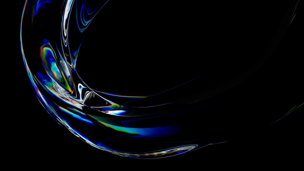a black background with a swirl of blue and green