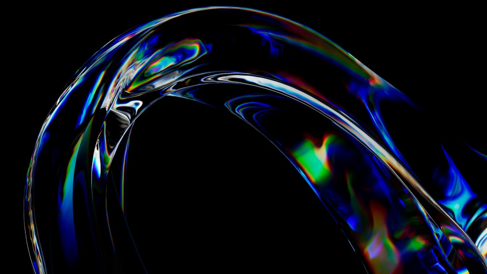 a black background with a blue and green swirl