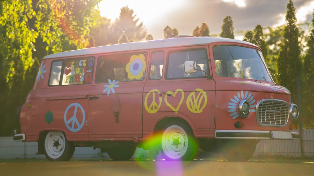 a red van with peace signs painted on it