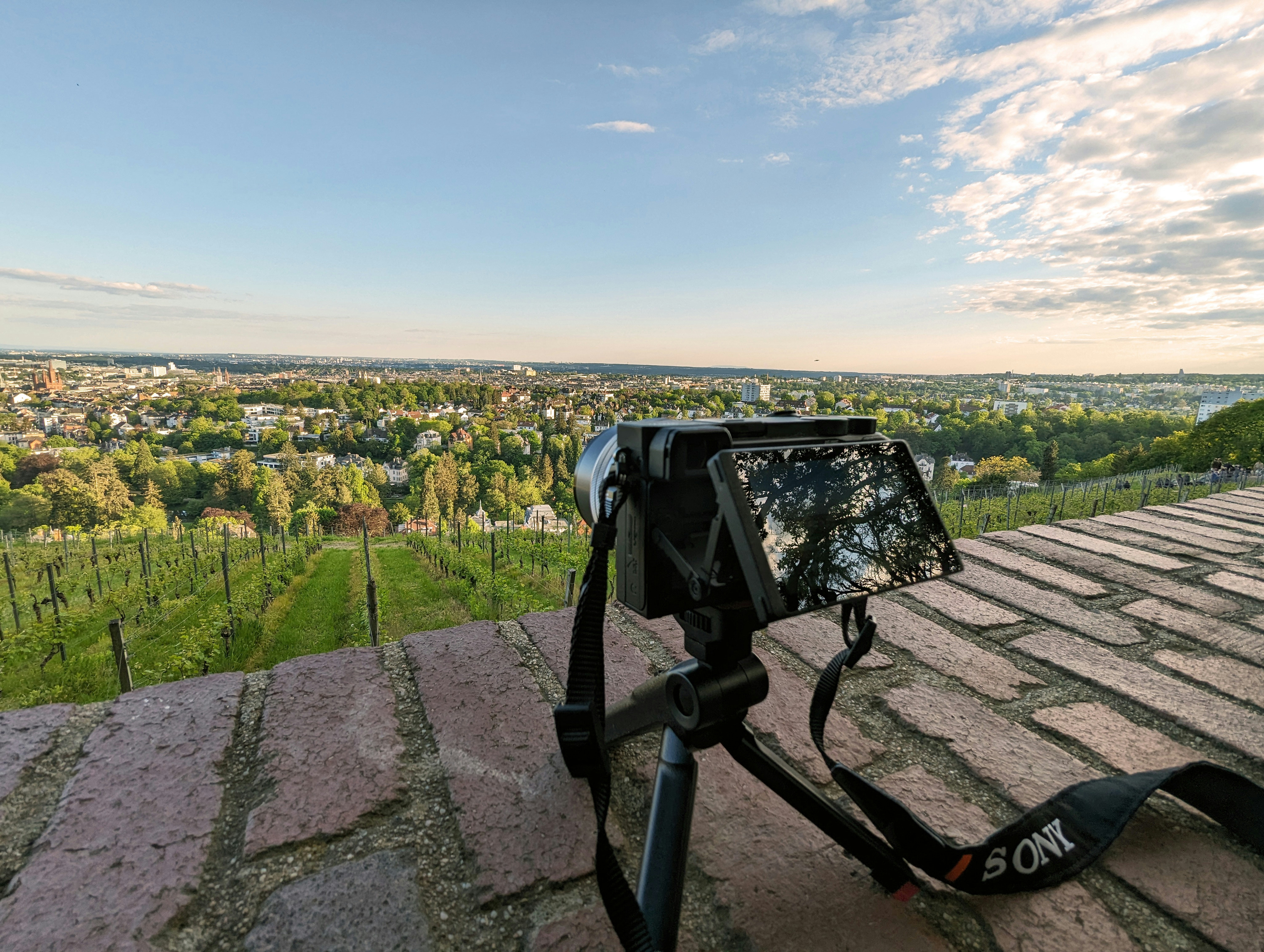 a camera sitting on top of a brick roof