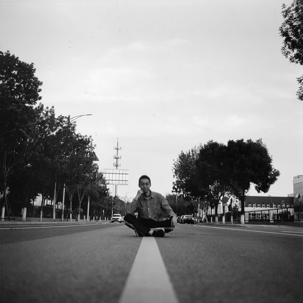 a man riding a skateboard down the middle of a street