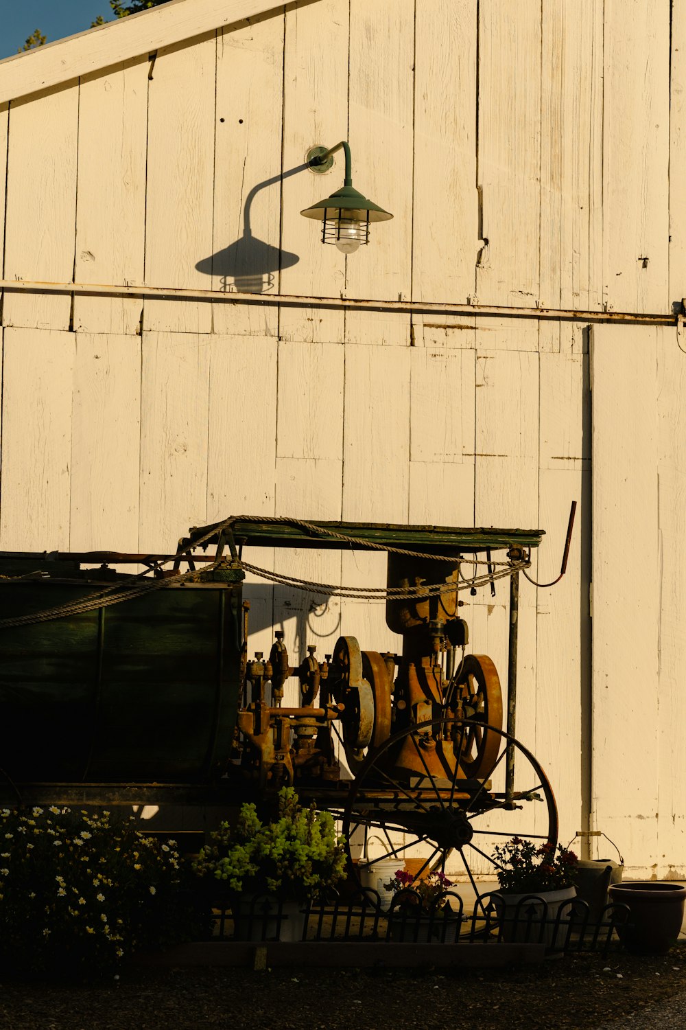 a tractor parked in front of a white building