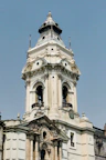a tall building with a clock on the top of it