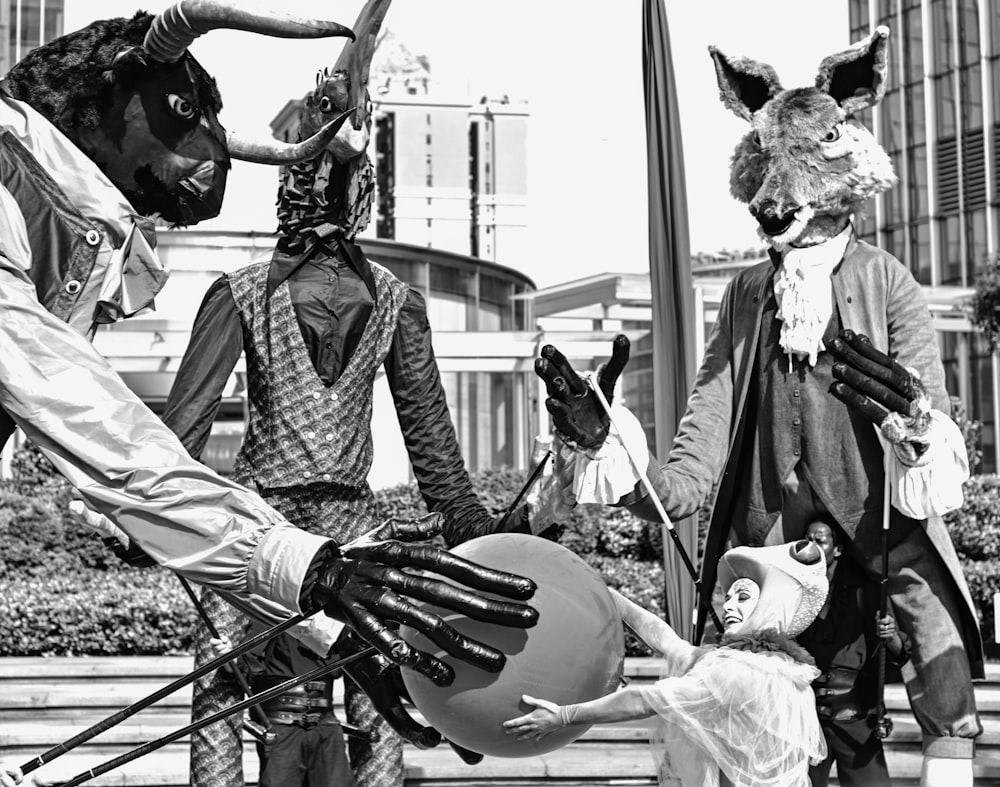 a black and white photo of a group of people in costume