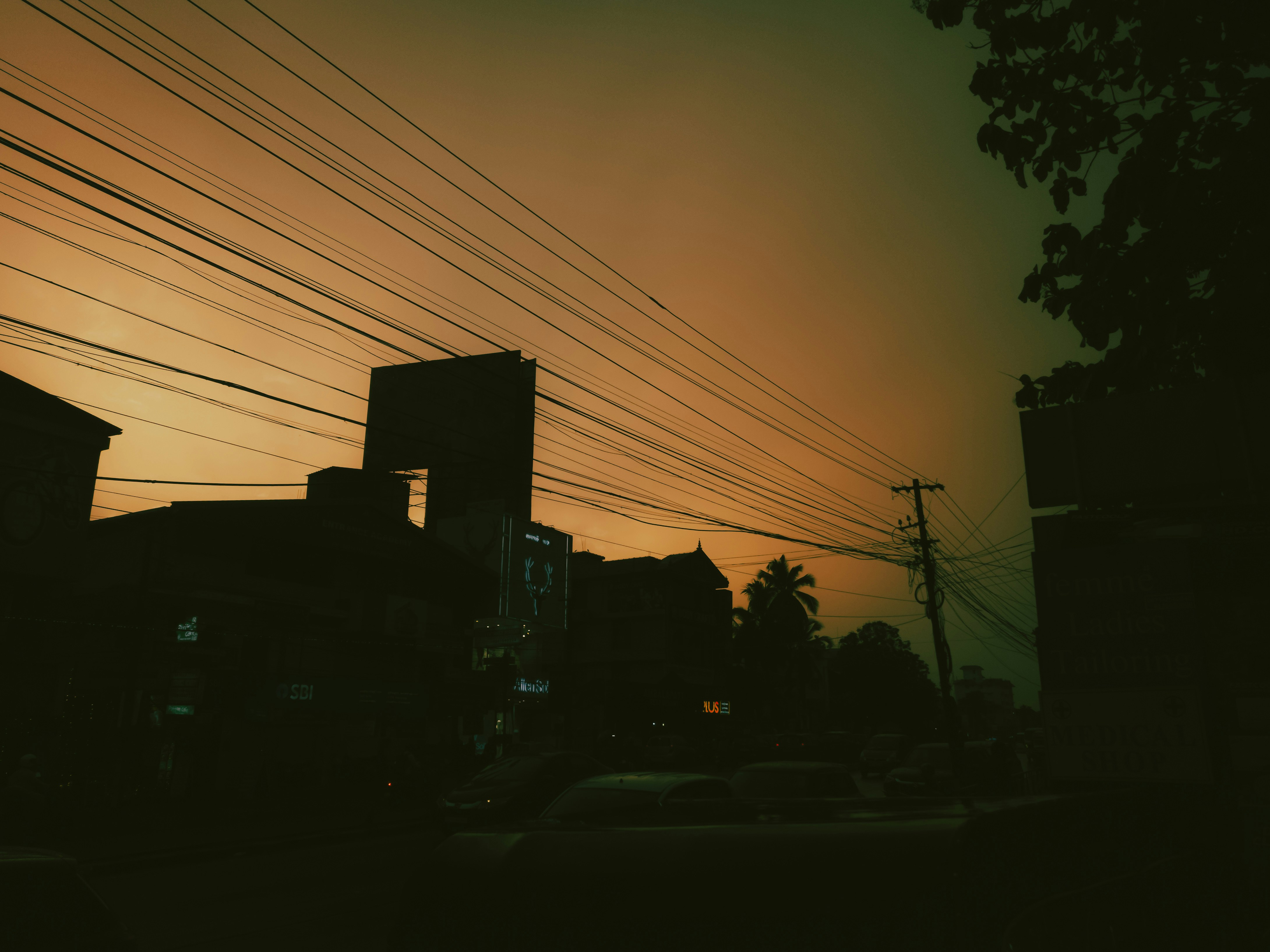 a city street with power lines above it