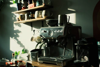 a coffee maker sitting on top of a wooden table