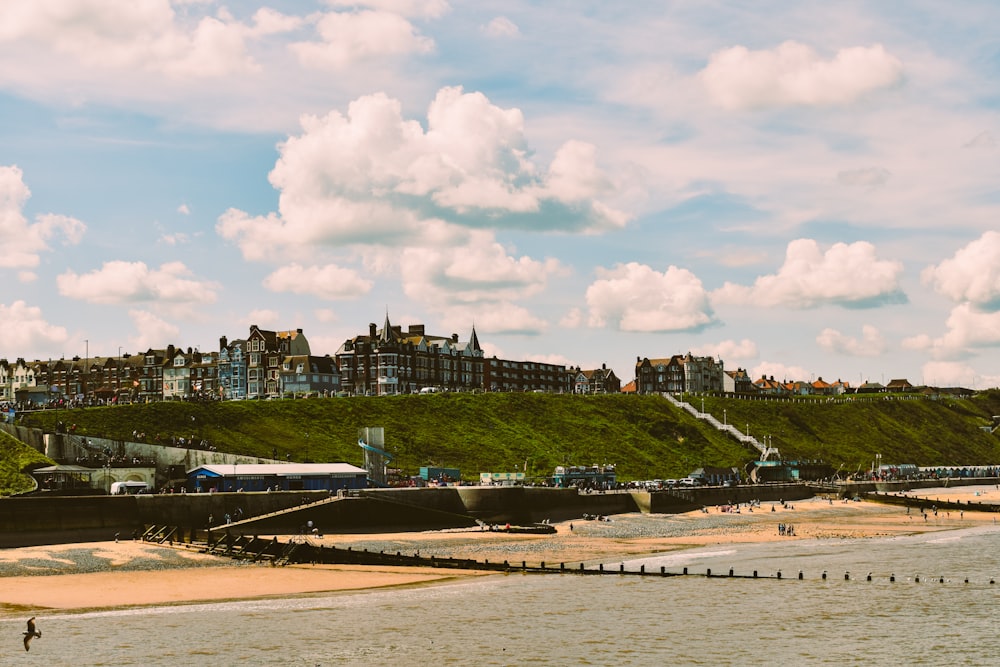 a view of a beach with a train on the tracks