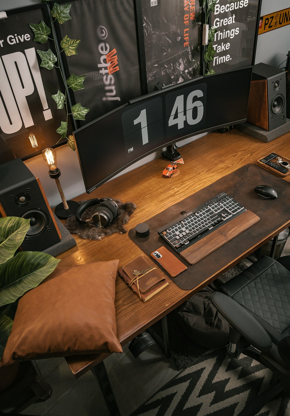 a desk with a keyboard, mouse and speakers