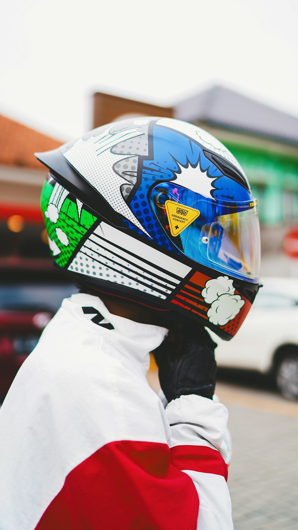 a person wearing a motorcycle helmet on a street