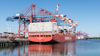 a large cargo ship docked at a dock