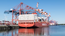 a large cargo ship docked at a dock