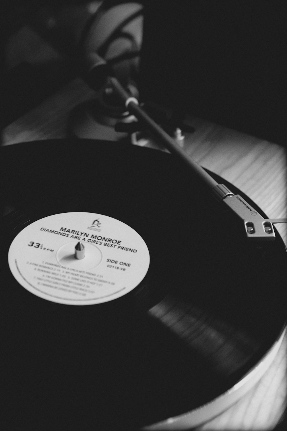 a black and white photo of a record player