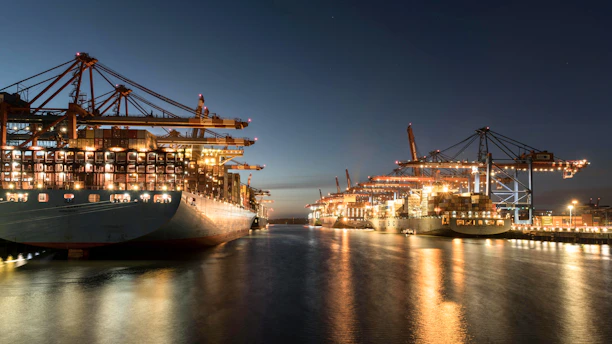 a large ship in a harbor at night