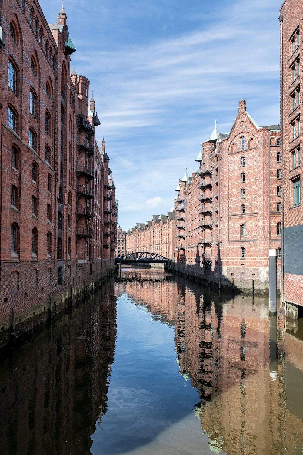 a river running through a city next to tall buildings