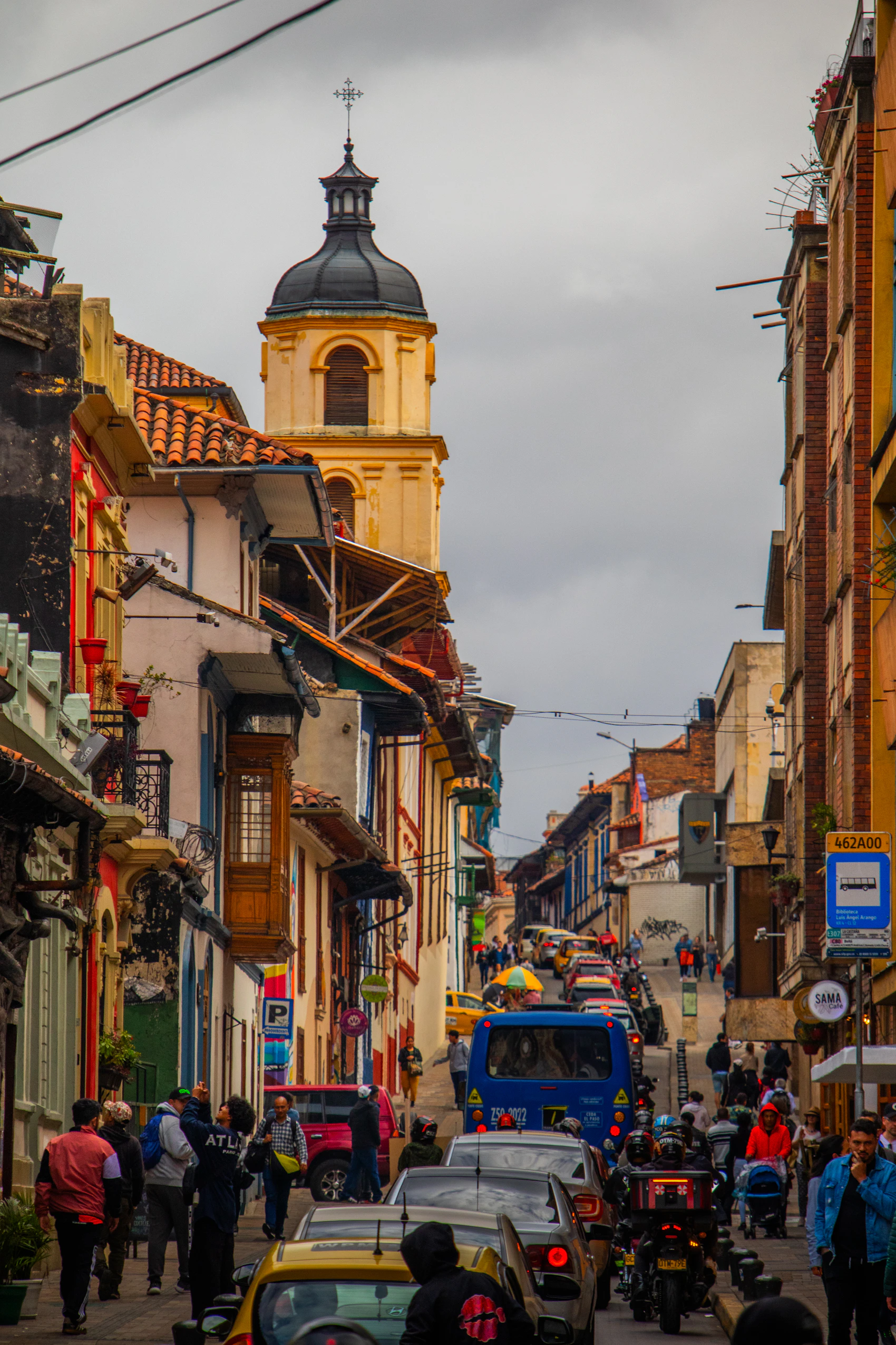 A busy Bogotá avenue filled with city traffic