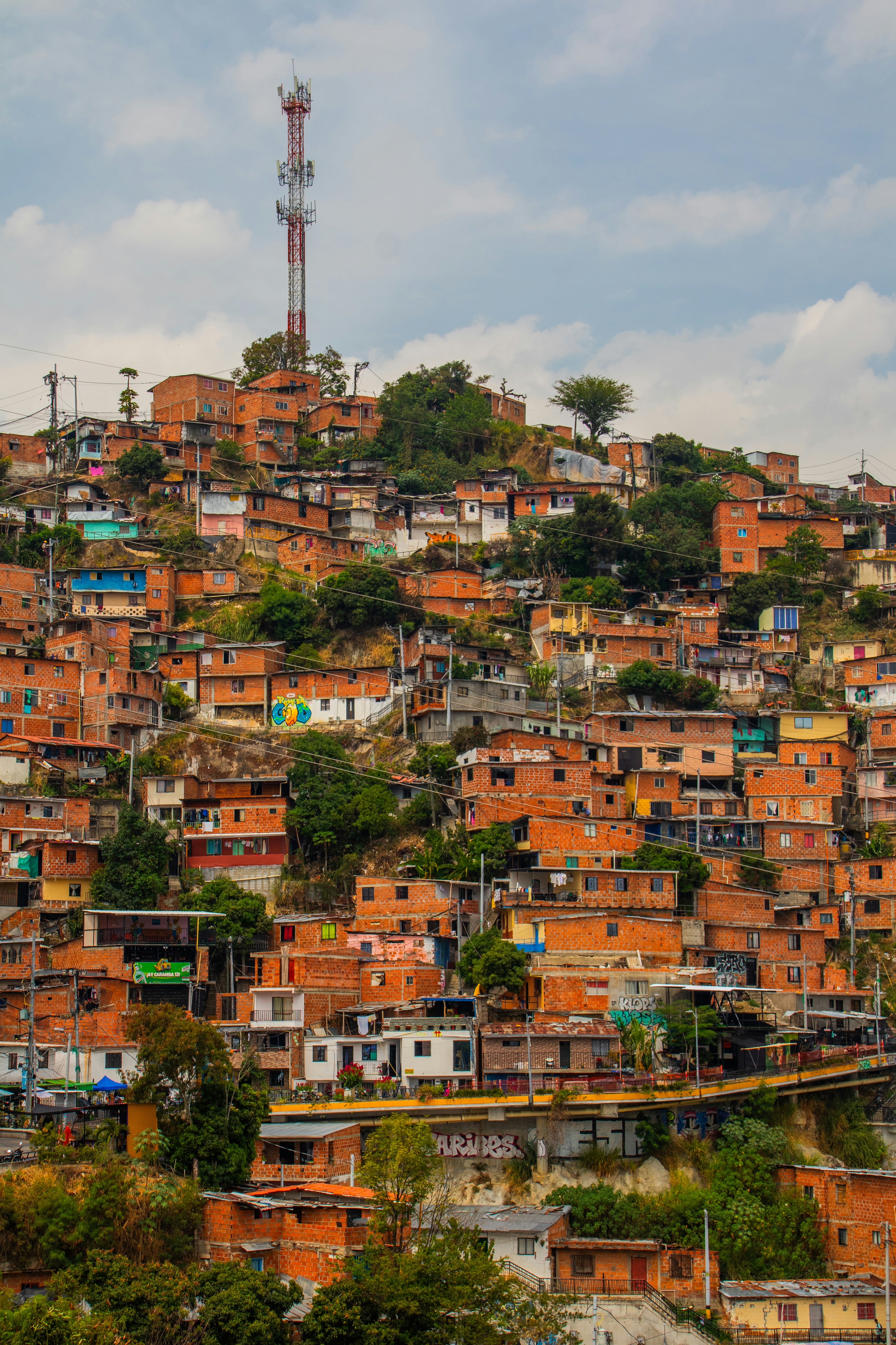 a very tall hill with lots of houses on top of it