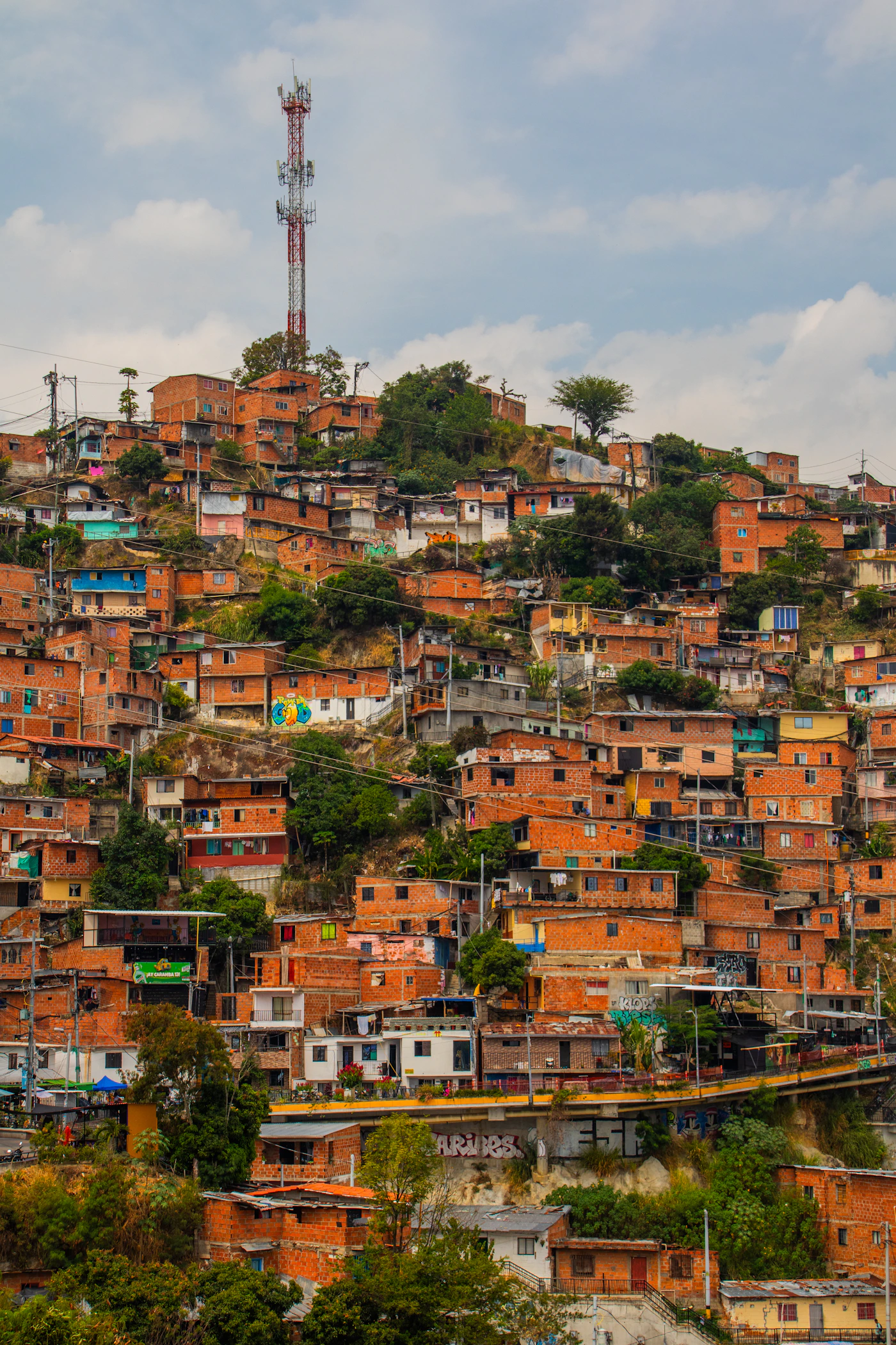 Medellín Colombia hillside comunas with densely packed residential buildings climbing the steep slopes of the Aburra Valley