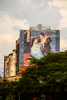 a large mural of a man and woman on the side of a building